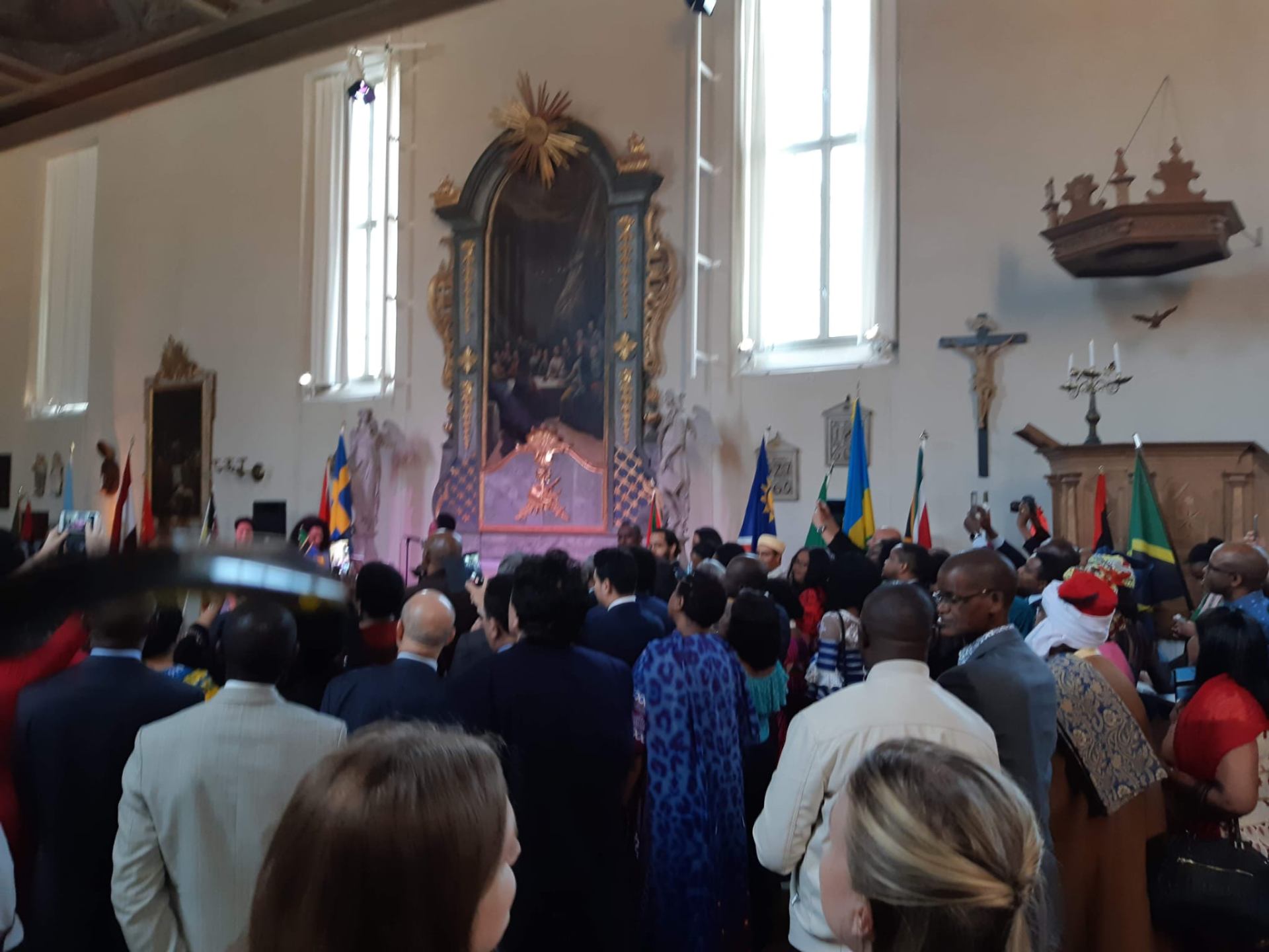 Ambassadors and guests with national flags inside the ceremony hall at Africa Day 2017 in Stockholm